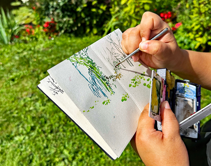 Kunstenaar in park Monet - La Maison et les Jardins de Claude Monet